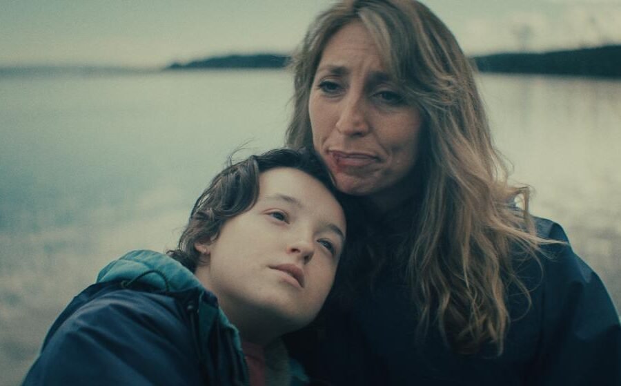 Daisy Haggard and Bella Ramsey embracing in Maya